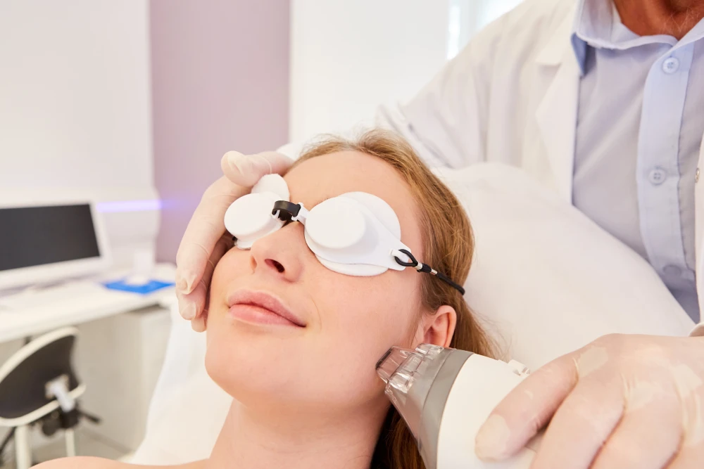 Woman receiving laser skin resurfacing treatment at a clinic.